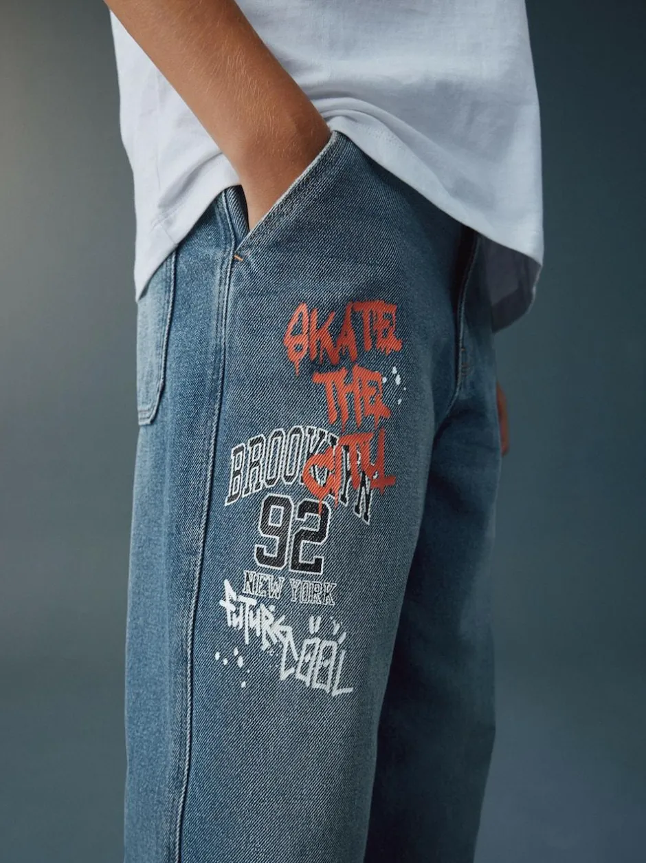 Next Varsity All-Over Print Mid Blue Denim Wide Fit Authentic Jeans (3-16yrs) New
